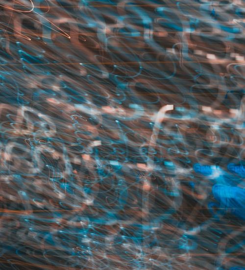 An abstract image representing energy and flow with neon lime lines.